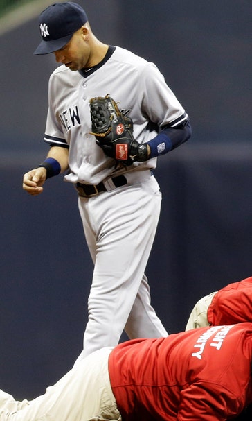Yankees' Tanaka beats Brewers; fan interrupts game to ‘hug’ Jeter